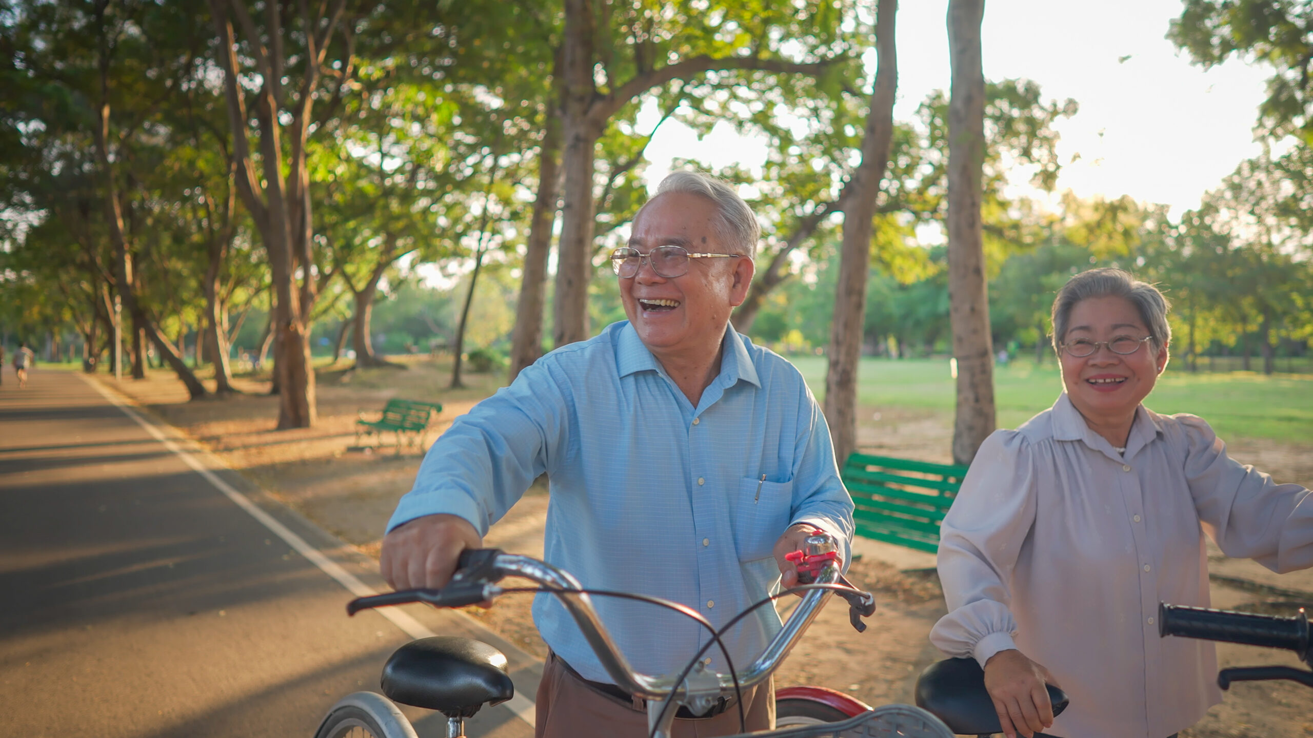 Smiling senior couple jogging in the park